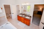 Double granite vanity, separate water closet with shower and toilet